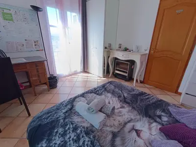 a room with a bed with two towels on it at Double room with great view in Nice