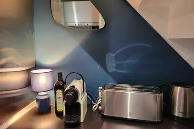 a kitchen counter with a sink and a mirror at 06A4 - Situation exceptionnelle au Port de Nice in Nice