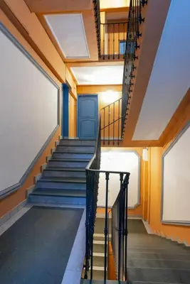 a staircase in a building with a blue door at 06A4 - Situation exceptionnelle au Port de Nice in Nice
