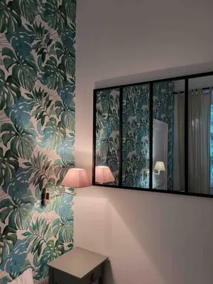 a bathroom with a mirror and a table with a lamp at 06A4 - Situation exceptionnelle au Port de Nice in Nice