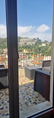 a view of a balcony with chairs and a table at NICE STUDIO 26m2 avec TERRASSE 16m2 in Nice