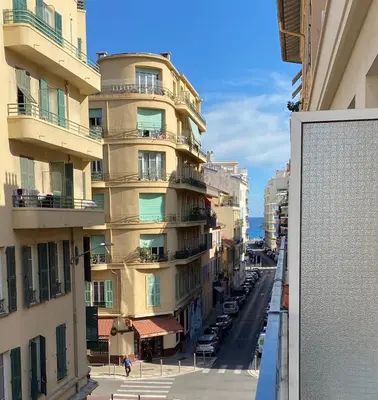 a view of a city street with tall buildings at The entire apartment 2 rooms, Balcony, Sea view in Nice
