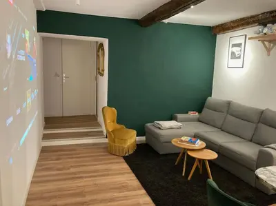 a living room with a couch and a table at Appartement Vieux Nice Garibaldi rénové in Nice