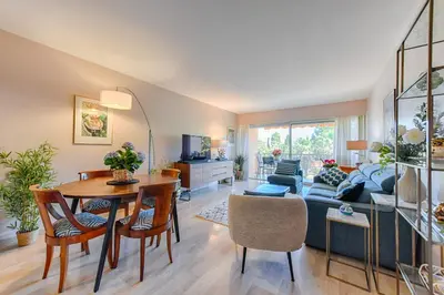 a living room with a table and a couch at Happyfew Sainte Anne in Nice
