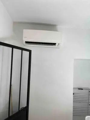 a white air conditioner on the ceiling of a room at Charming Apartment in Nice in Nice