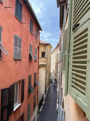 an alley with buildings and a street in a city at Charming Apartment in Nice in Nice