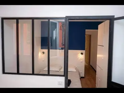 a room with a window with a bed in it at Charming Apartment in Nice in Nice