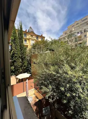 a view from a balcony of a building and trees at Carré d'or Studio 2 in Nice