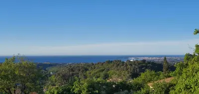 a view of the ocean from a hill at Paisible et Spacieuse Villa avec 4 suites indépendantes in La Gaude
