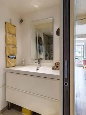 a bathroom with a sink and a mirror at Joli loft entre le vieux Nice et le port in Nice