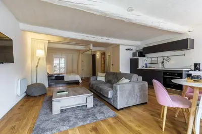 a living room with a couch and a table at Joli loft entre le vieux Nice et le port in Nice