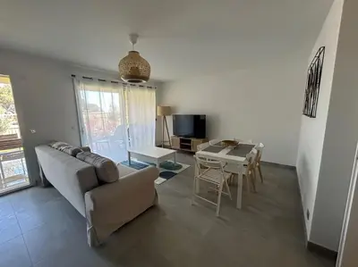 a living room with a couch and a table at Prestige View 103 By Avecoeur in Èze
