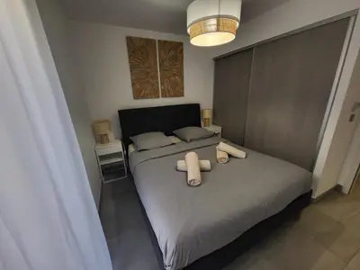 a living room with a kitchen and a couch at Prestige View 103 By Avecoeur in Èze