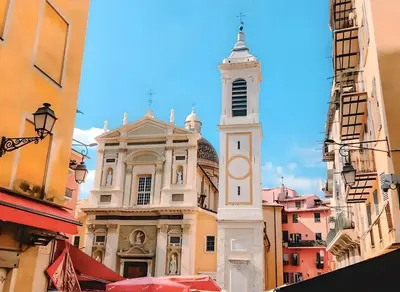 a tall building with a clock tower in a city at Spacieux Loft Cœur Vieux Nice in Nice