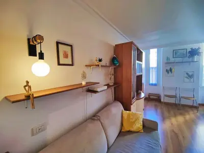 a living room with a couch in a room at Central close to beaches and shops, up till 6 pers in Nice