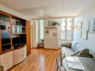 a living room with a couch and a table at Central close to beaches and shops, up till 6 pers in Nice