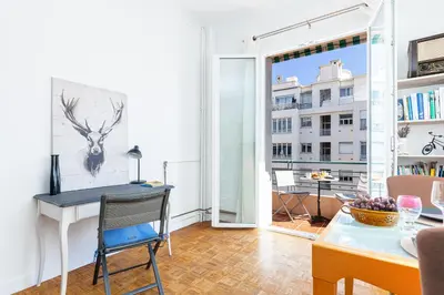 a living room with a desk and a table at The place to be in Nice in Nice