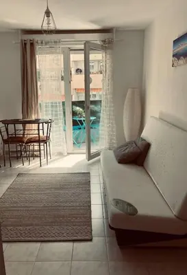 a table and two chairs on a balcony at Studio Nice proche plages / université in Nice