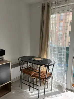 a living room with a couch and a table at Studio Nice proche plages / université in Nice
