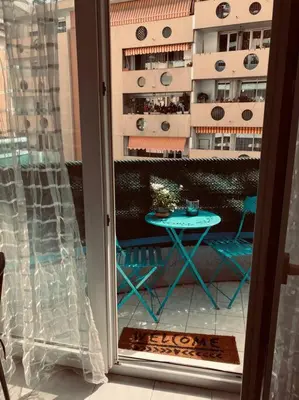 a view of a patio with a table on a balcony at Studio Nice proche plages / université in Nice