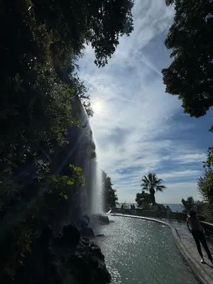 a person standing in front of a waterfall at Duplex spagiari in Nice