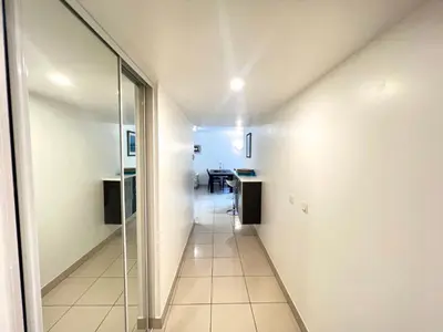 a hallway with a glass door leading to a kitchen at Sunlight Properties - Mirage - Central Nice with Parking and Terrace in Nice