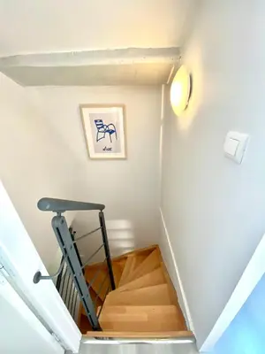 a stairwell with a treadmill in a room at Duplex Cosy au Cœur du Vieux-Nice in Nice