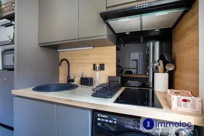 a kitchen with a sink and a stove at Apartment T2 Air-conditioned district Libération in Nice