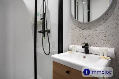 a bathroom with a sink and a shower at Apartment T2 Air-conditioned district Libération in Nice
