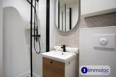 a bathroom with a sink and a shower at Apartment T2 Air-conditioned district Libération in Nice