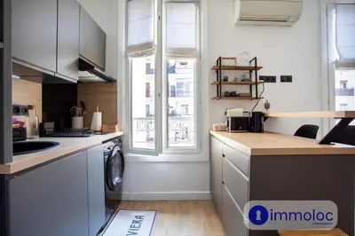 a kitchen with a washing machine and a window at Apartment T2 Air-conditioned district Libération in Nice