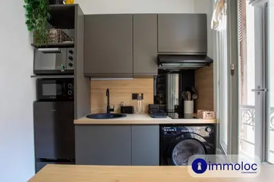 a kitchen with a sink and a washer and dryer at Apartment T2 Air-conditioned district Libération in Nice