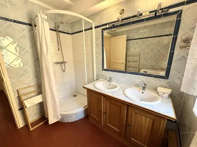 a bathroom with two sinks and a shower and a toilet at ApartHotel Riviera - BARILLERIE 4 - 3 pieces - Old Town Promenade Anglais in Nice