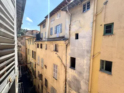 a view of an alley between two buildings at ApartHotel Riviera - BARILLERIE 4 - 3 pieces - Old Town Promenade Anglais in Nice