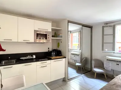 a kitchen with white cabinets and a sink at ApartHotel Riviera - MALONAT 3 - Grand Studio très calme -Old Town Promenade des Anglais in Nice