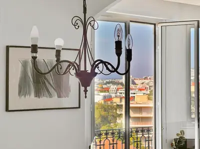 a chandelier hanging in front of a window at Le Palais Riviera in Nice