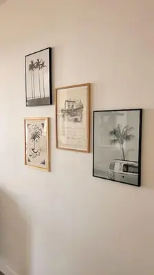four pictures are hanging on a wall at Le Palais Riviera in Nice