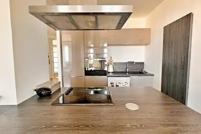 a kitchen with a counter with a sink in it at Le Palais Riviera in Nice