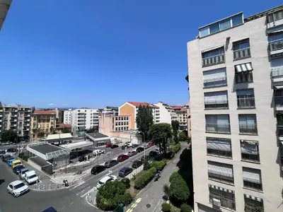 an aerial view of a city street with a building at Studio terrasse et parking privé in Nice