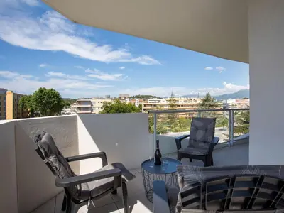 a balcony with chairs and a table with a view at Apartment Rive de Cagnes by Interhome in Cagnes-sur-Mer