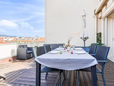 a table and chairs on a balcony with a view at Apartment Les terrasses de l'Escurial by Interhome in Nice