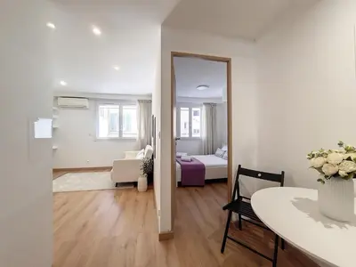 a living room with a table and a mirror at Nestor&Jeeves - COEUR RIVIERA - City Center - Near Beach in Nice