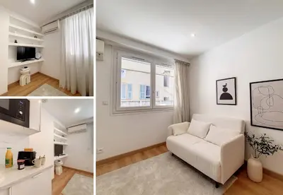 a living room with a couch and a window at Nestor&Jeeves - COEUR RIVIERA - City Center - Near Beach in Nice