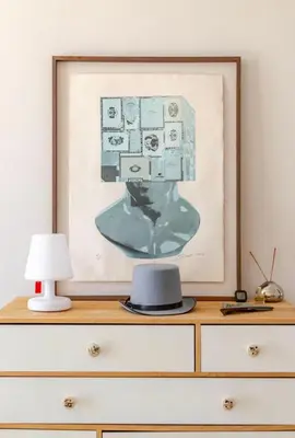 a picture on top of a dresser with a lamp at Cosy appartement, Vue Mer panoramique in Nice