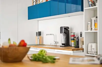 a kitchen with a sink and a counter top at La Cachette du Port! -Avec parking au Port de Nice in Nice