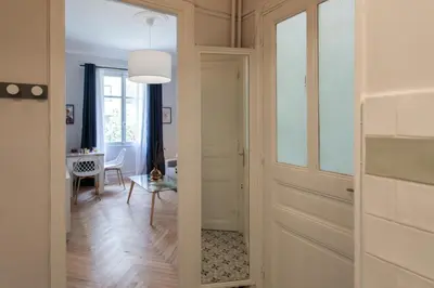 a hallway with a door leading to a dining room at 26 Nice Parc Imperial studio in Nice
