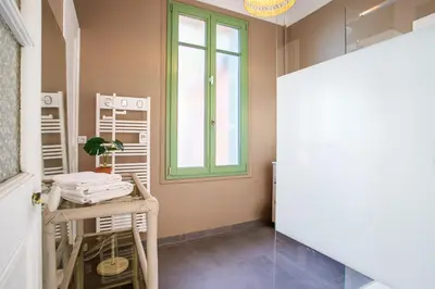 a room with a table and a window at Villa Reve d azur vi4353 by Riviera Holiday Homes in Nice