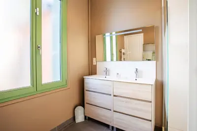 a bathroom with a sink and a mirror at Villa Reve d azur vi4353 by Riviera Holiday Homes in Nice