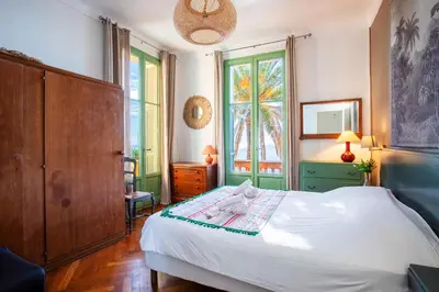 a bedroom with a bed and a window at Villa Reve d azur vi4353 by Riviera Holiday Homes in Nice