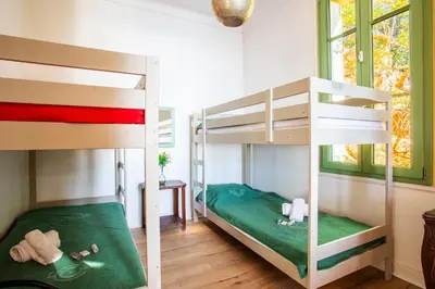 a bunk bed room with two bunk beds in it at Villa Reve d azur vi4353 by Riviera Holiday Homes in Nice